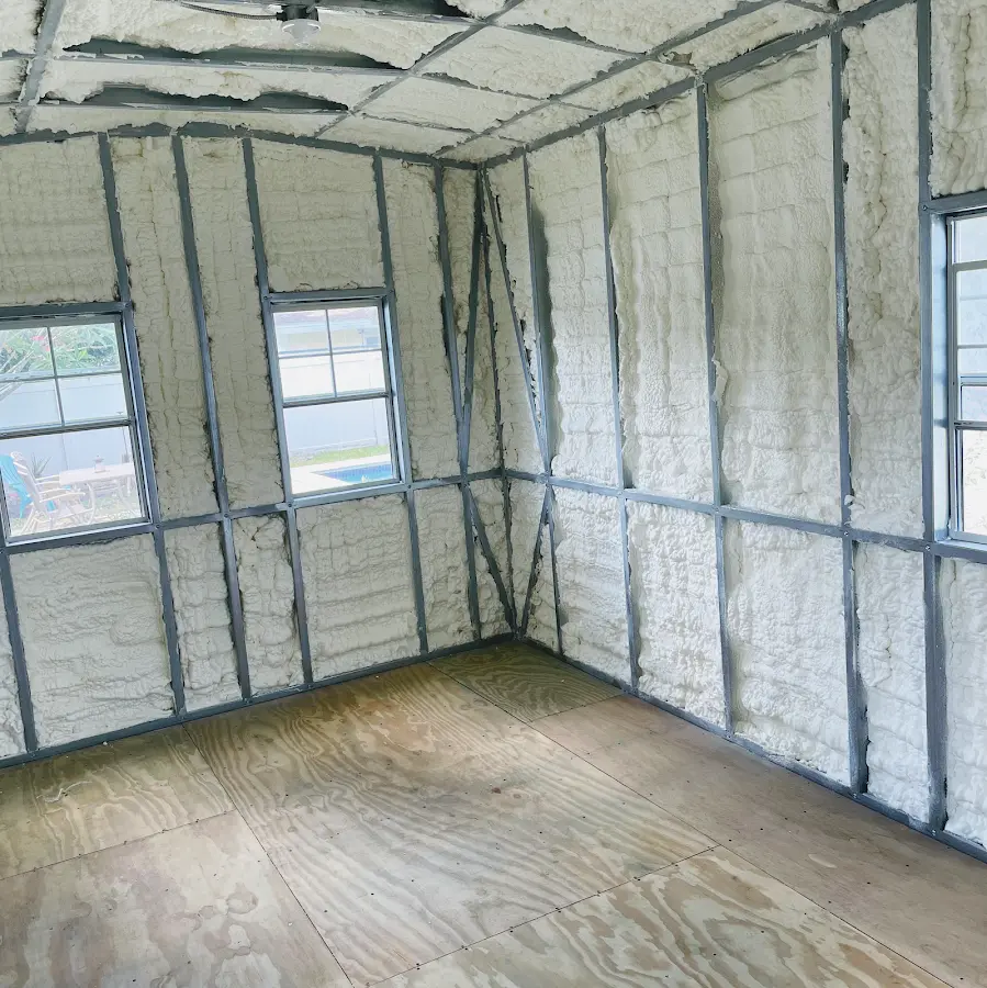 Closed-cell spray foam insulation applied to wall cavities in a residential project in Islip